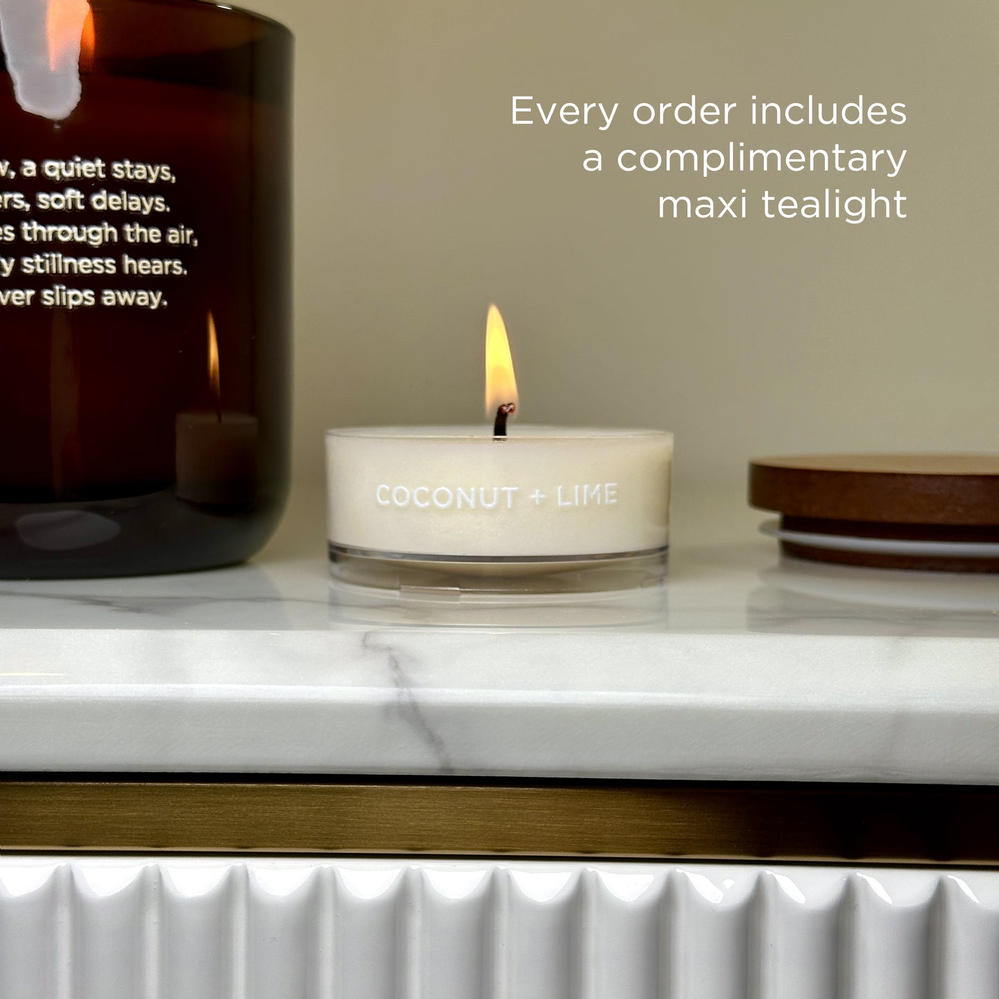 A bonus tealight candle with the Coconut + Lime scent, included with every Lakewood Candles order. It’s photographed beside a full-size candle and wooden lid. The text reads: “Every order includes a complimentary maxi tealight.” This clean, well-lit image emphasizes value, generosity, and extra care in packaging. Great for building customer trust and highlighting small thoughtful details.
